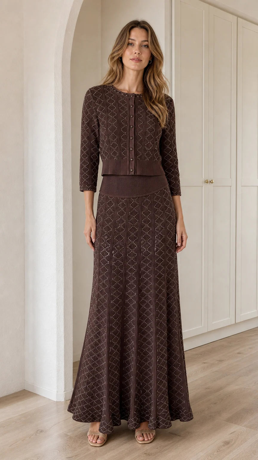 Front view of model wearing Chocolate Brown pointelle knit cardigan and maxi skirt set