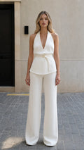 Front view of model wearing white halter top and wide leg pants set