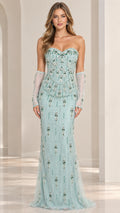 Front full-length view of model in mint green strapless beaded corset evening gown with opera gloves