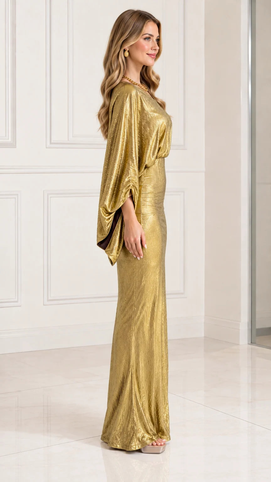 Side view of gold metallic draped maxi dress showing silhouette and drape