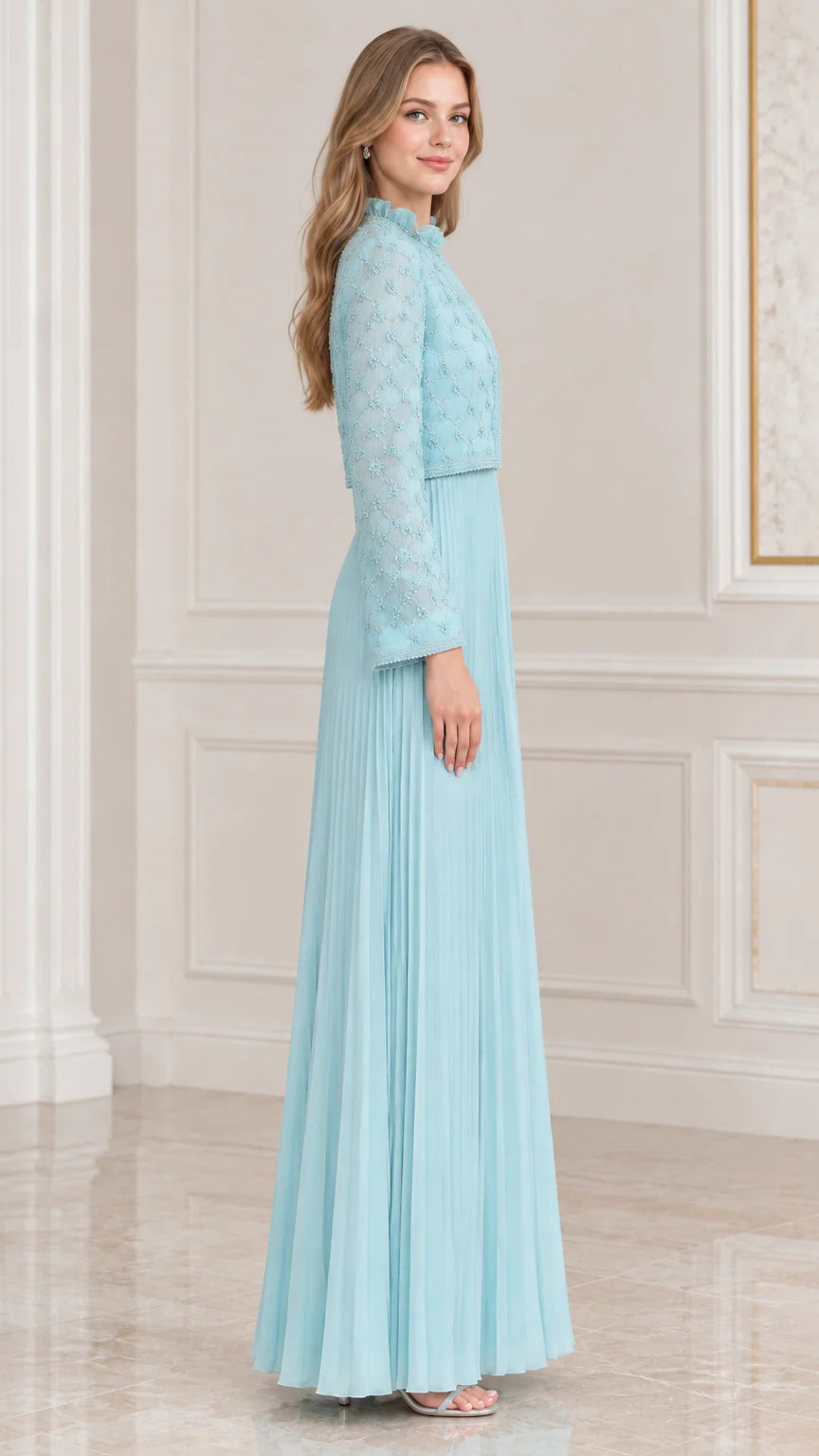 Side profile view of sky blue pleated formal gown and long sleeve embroidered jacket