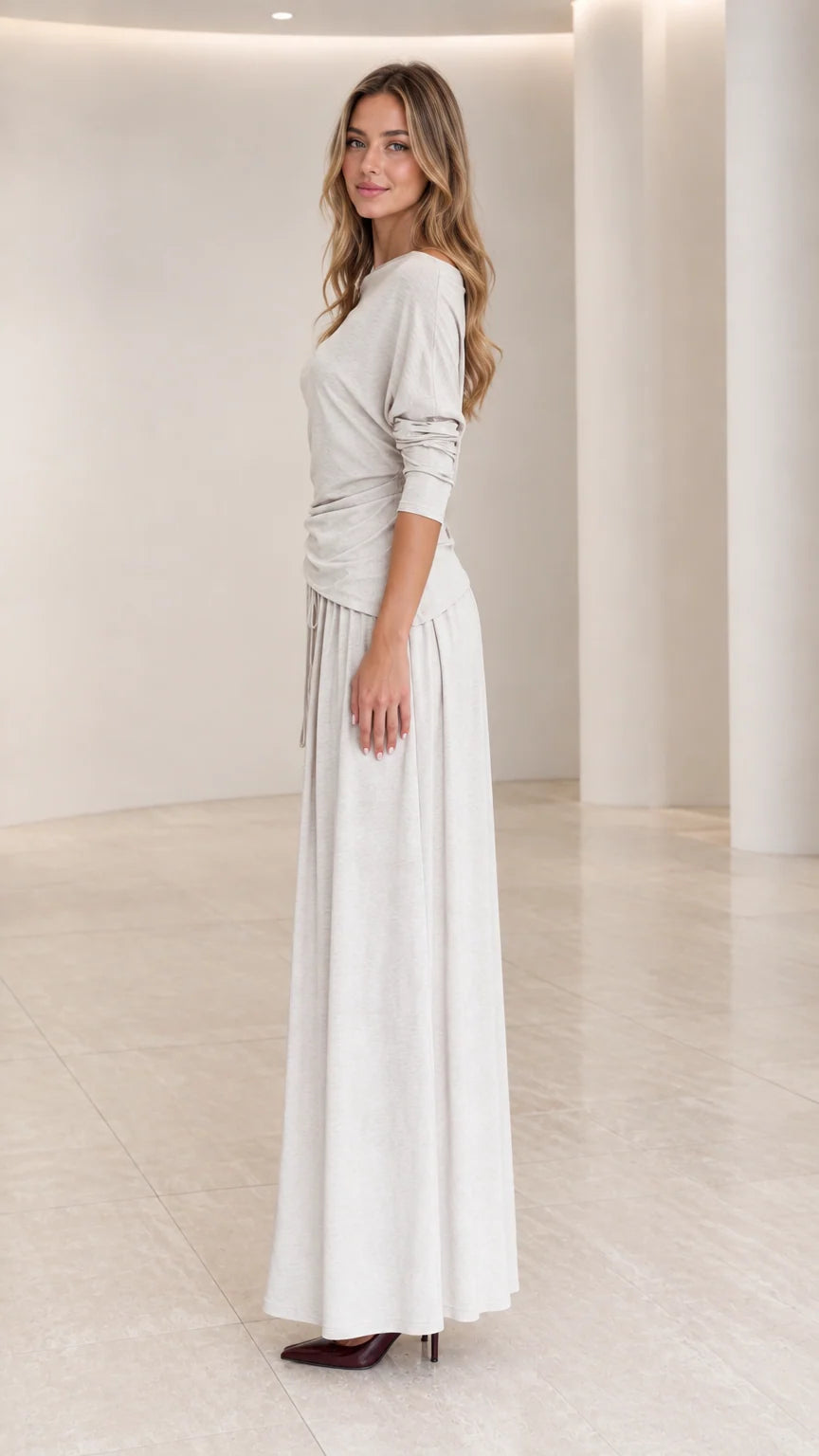 Side full view of woman wearing Heather Grey long sleeve ruched maxi dress