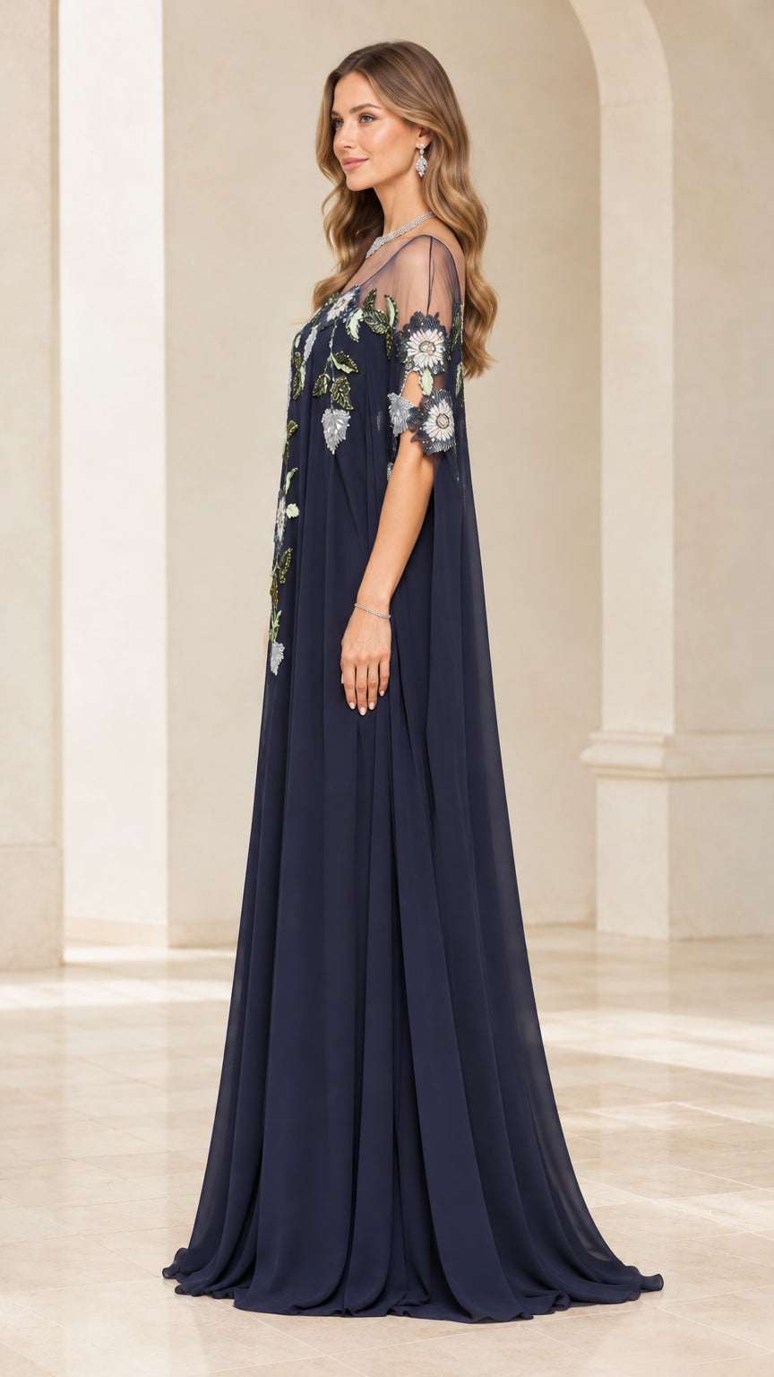 Side profile of navy blue chiffon maxi evening dress with cape detail