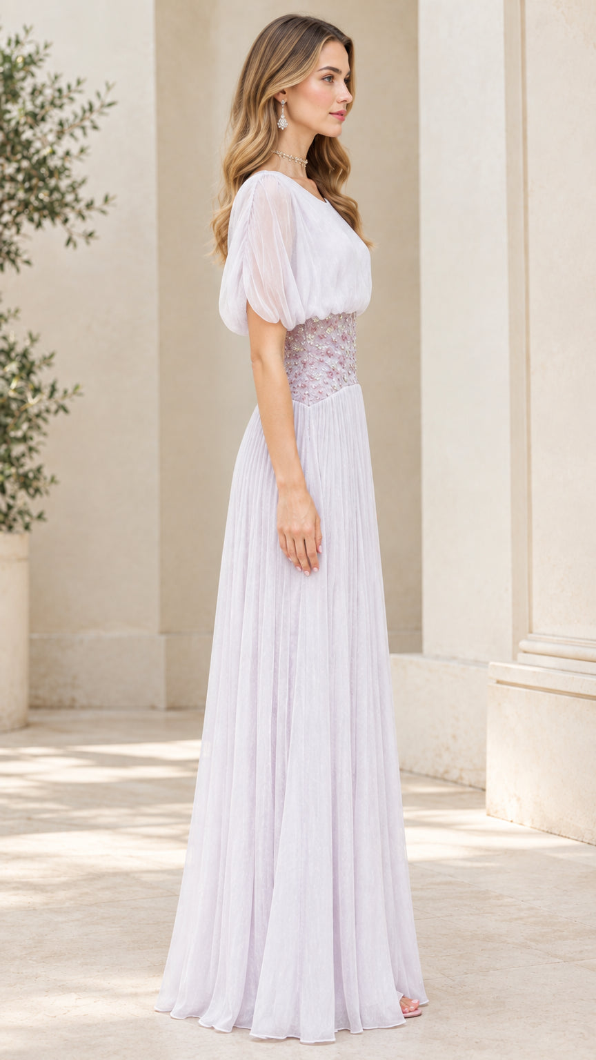 Side profile view of lavender pleated evening gown with short puff sleeves
