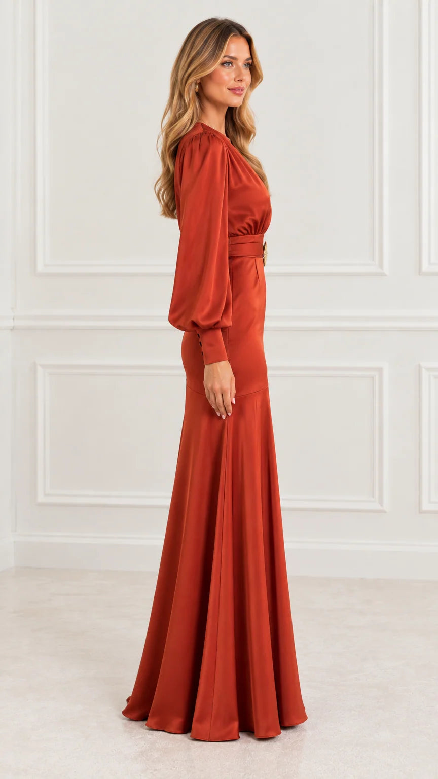 Side profile of model in rust orange satin floor-length evening dress