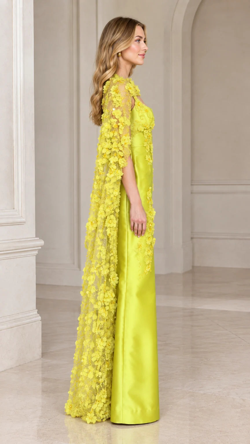 Side profile view of lime green floor-length cape evening gown