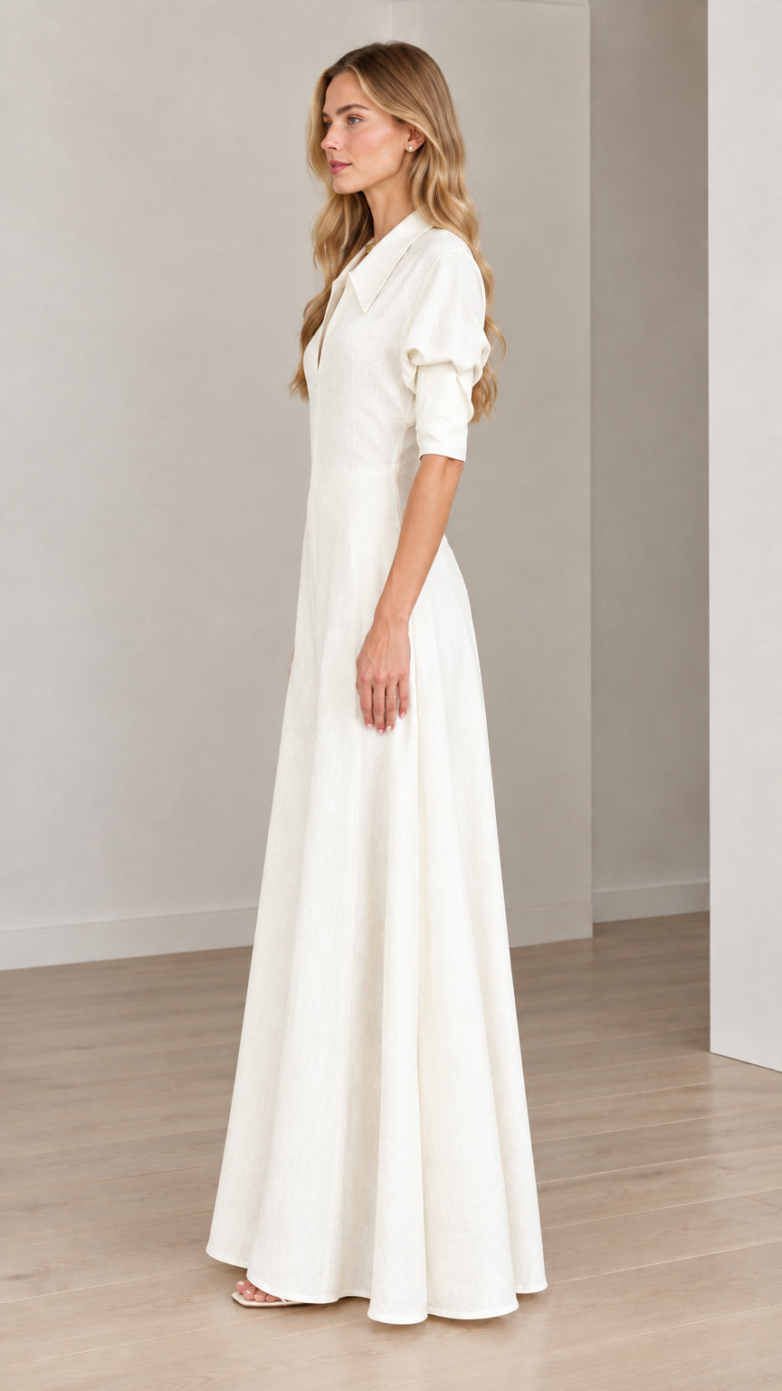 Side profile view of model wearing an Ivory White collared wide-leg maxi jumpsuit