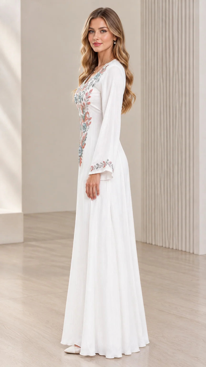 White embroidered maxi dress side view showing graceful drape