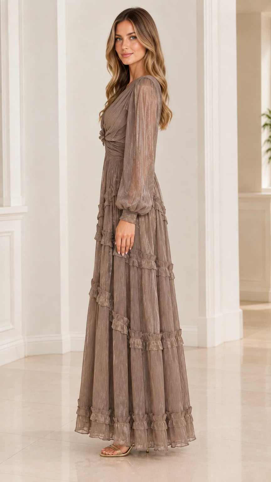 Side profile view of taupe plissé tiered maxi evening gown