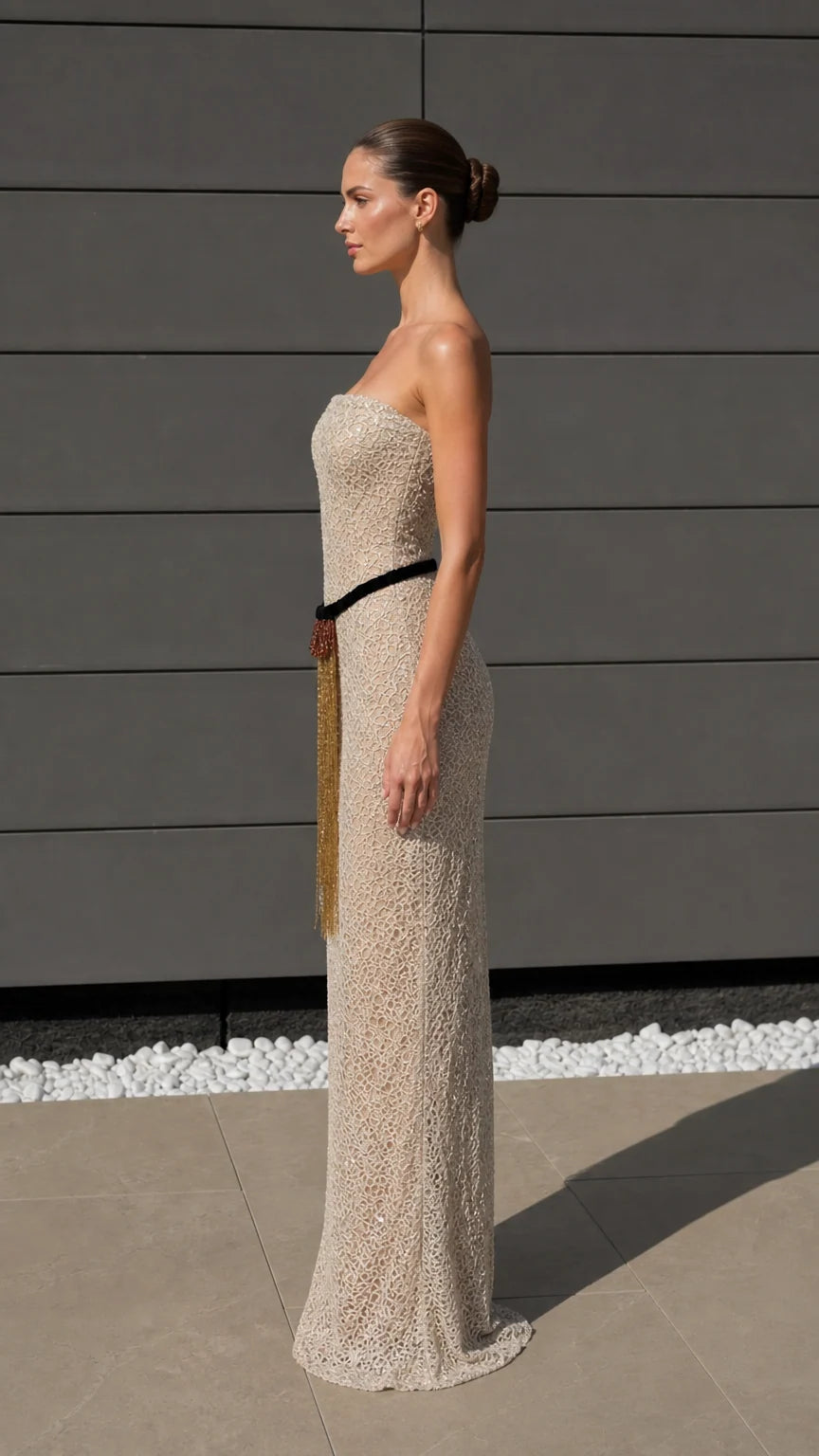 Side profile view of champagne evening gown