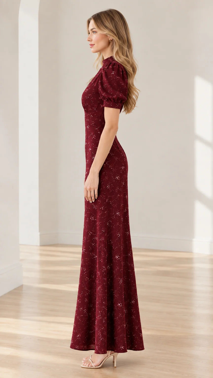Side profile view of burgundy floral short sleeve long formal dress