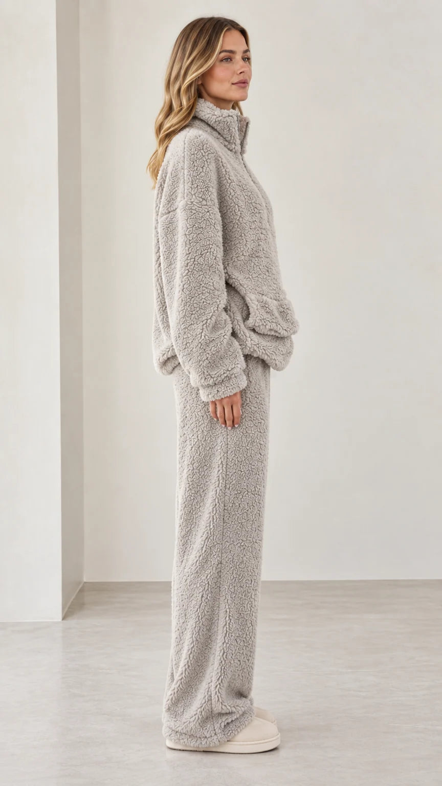 Side profile view of model in light gray teddy fleece matching lounge set