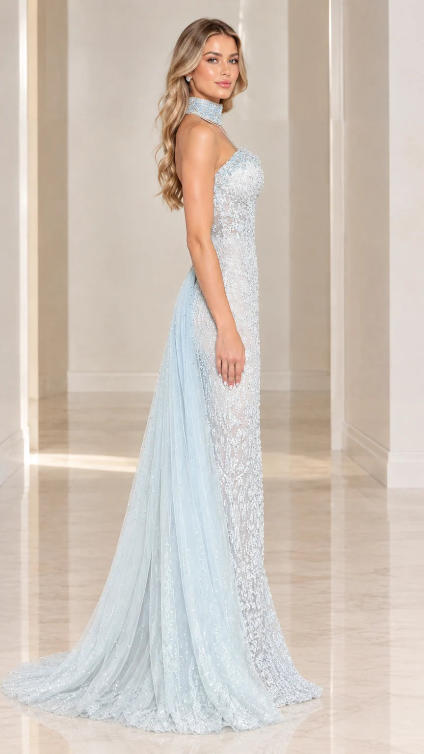 Side profile of model in Light Blue lace formal gown showing sweeping tulle train