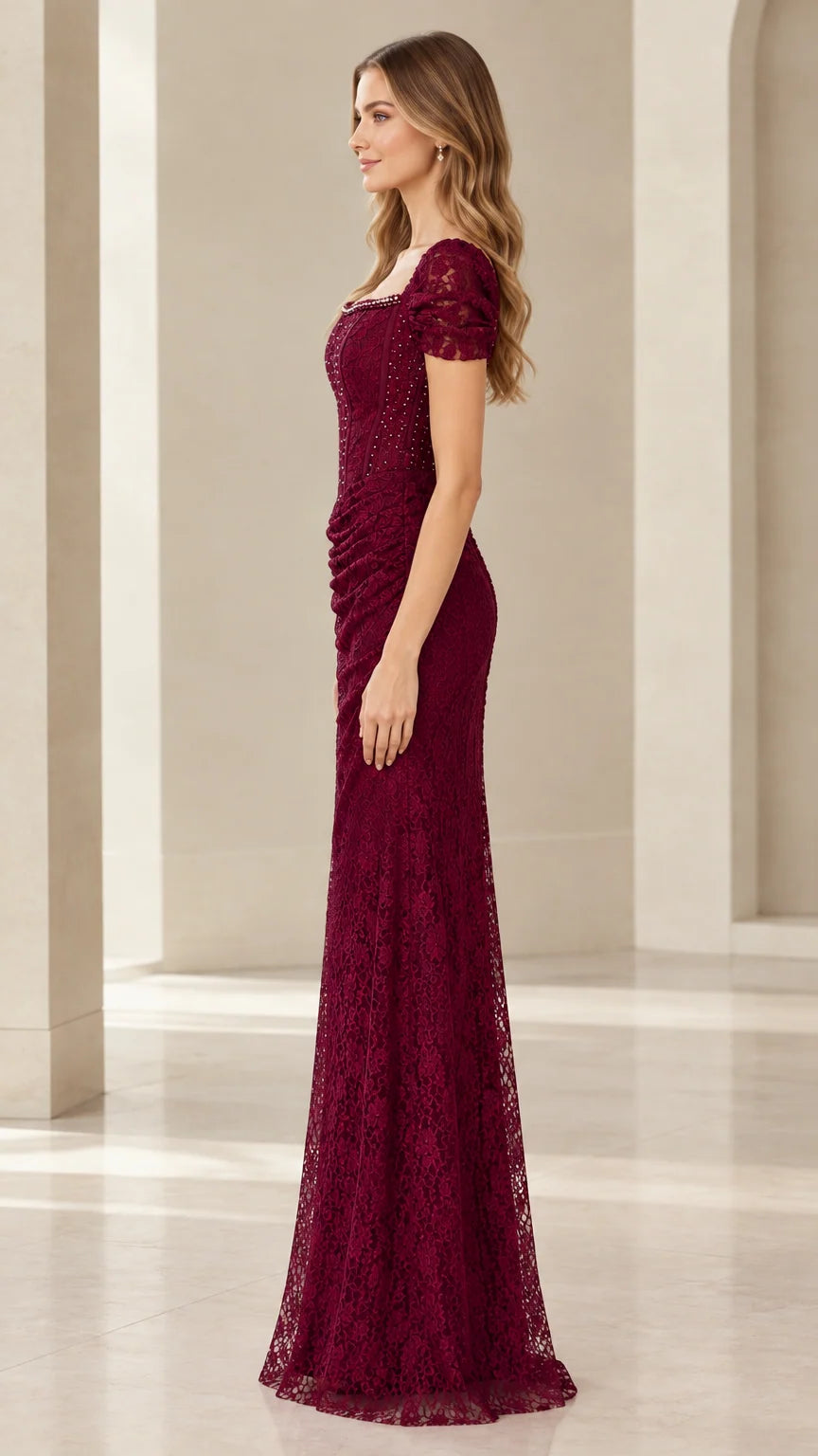 Side profile view of Burgundy floor-length lace formal gown