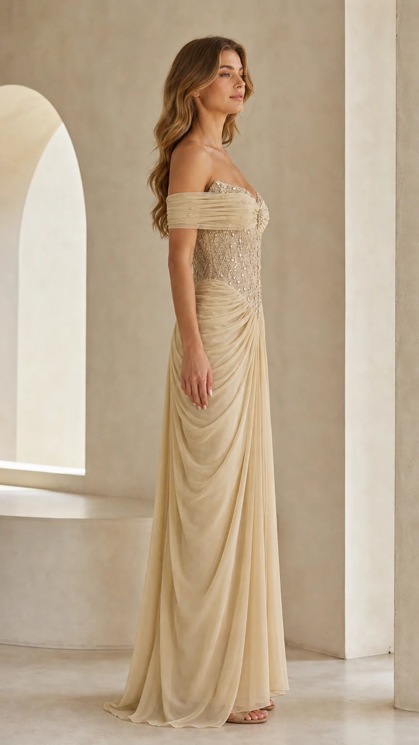 Side profile view of champagne draped formal maxi gown
