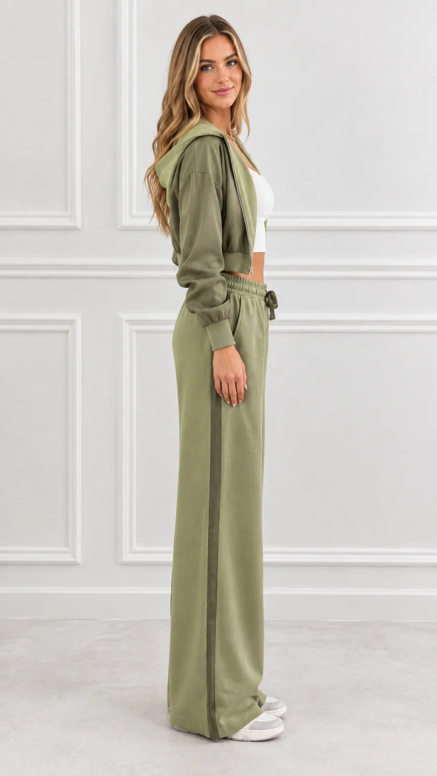Side view of woman wearing olive green two-piece loungewear set showing wide-leg pant profile