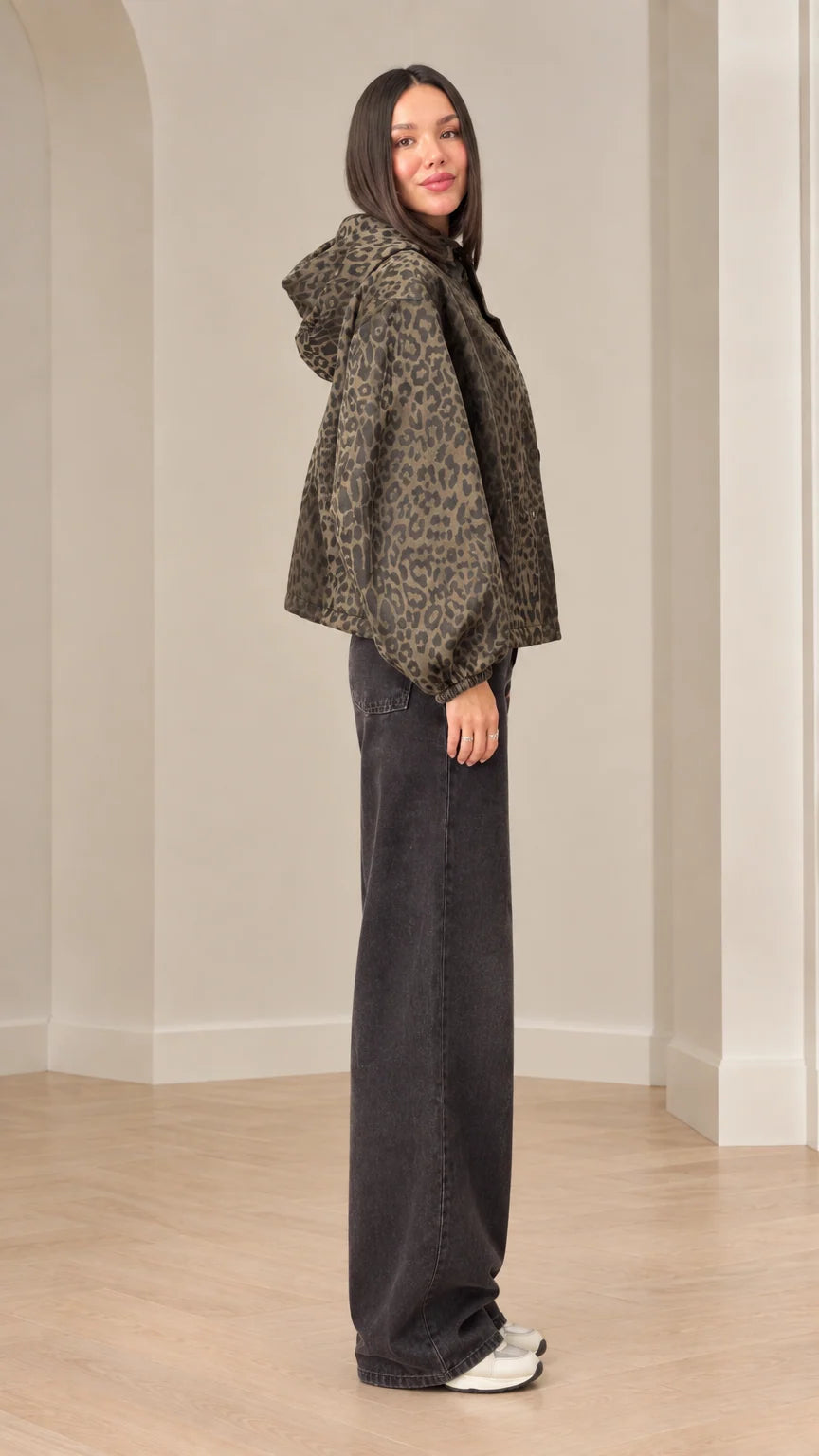 Side profile of model wearing brown leopard print jacket with hood and lantern sleeves