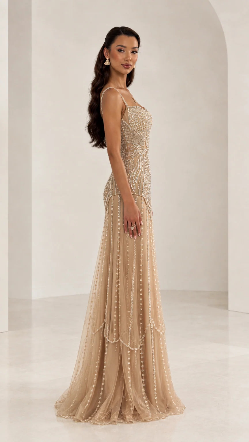 Side profile of woman in Champagne embellished sequin floor-length formal dress