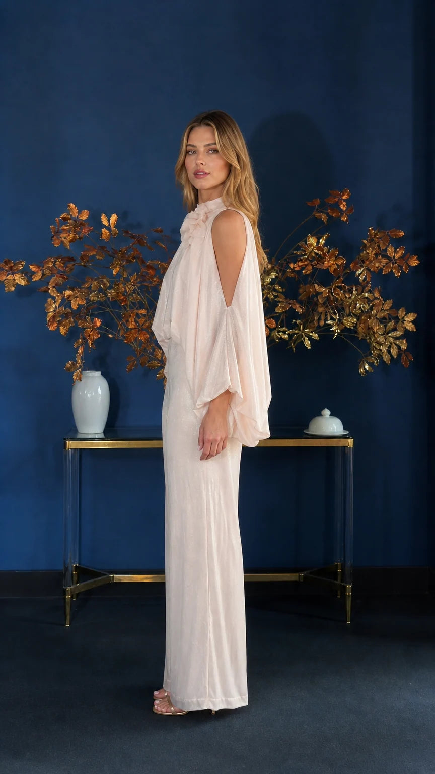 Side profile view of champagne jumpsuit showing wide leg silhouette