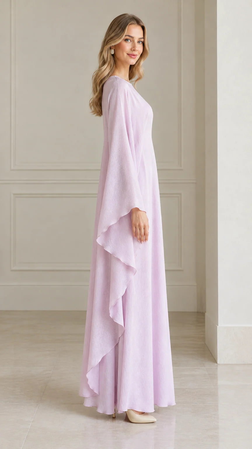 Side angle view of woman modeling pastel lavender cape dress