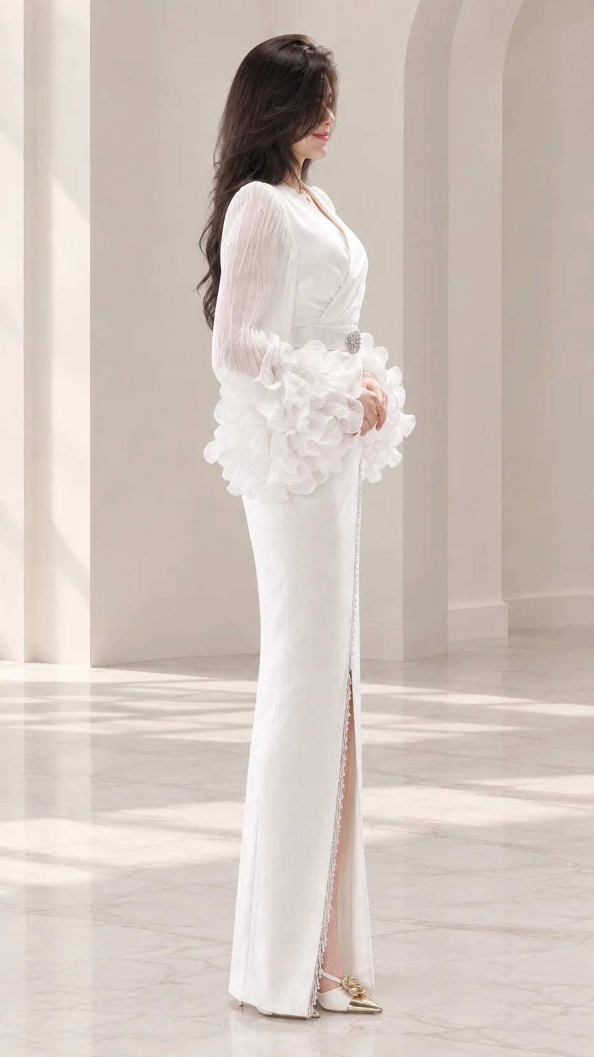 Side profile of white floor-length evening dress showing front slit detail