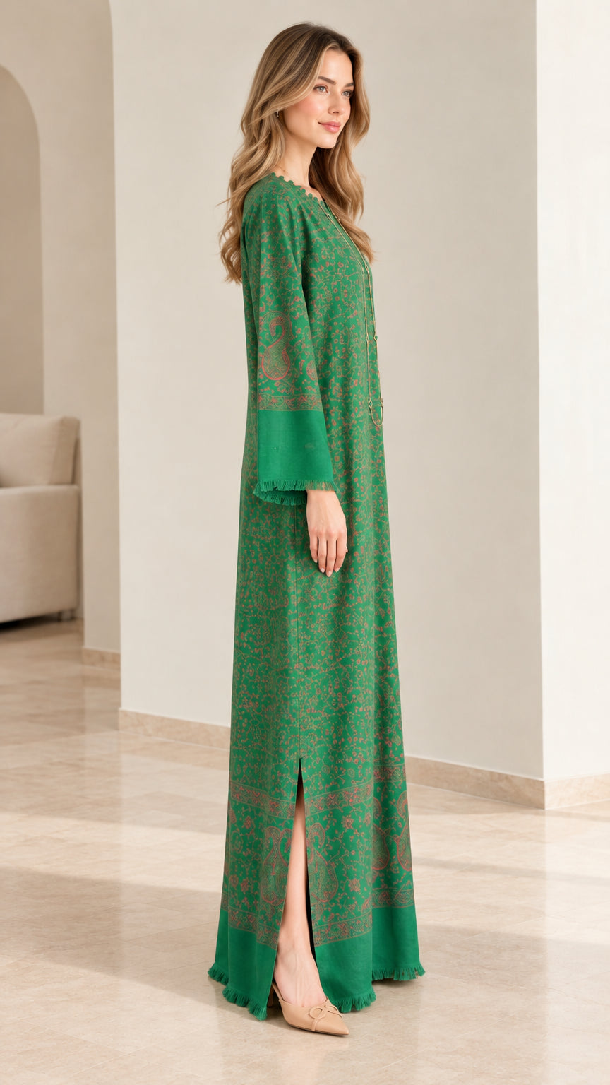 Side profile view of emerald green kaftan dress highlighting the side slit hem