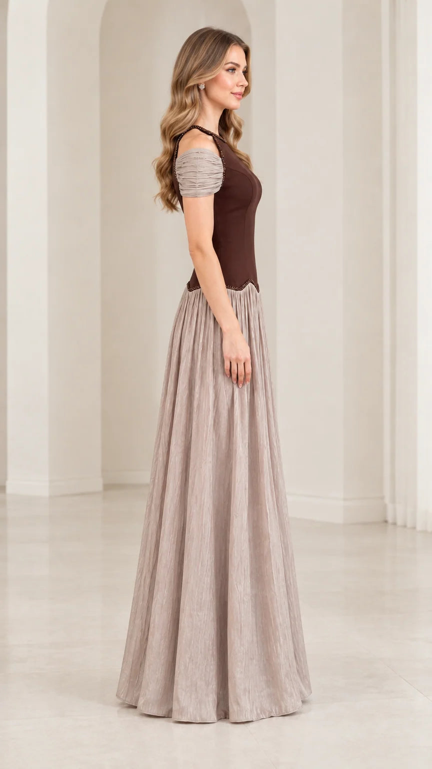 Side profile view of chocolate brown and taupe pleated evening gown