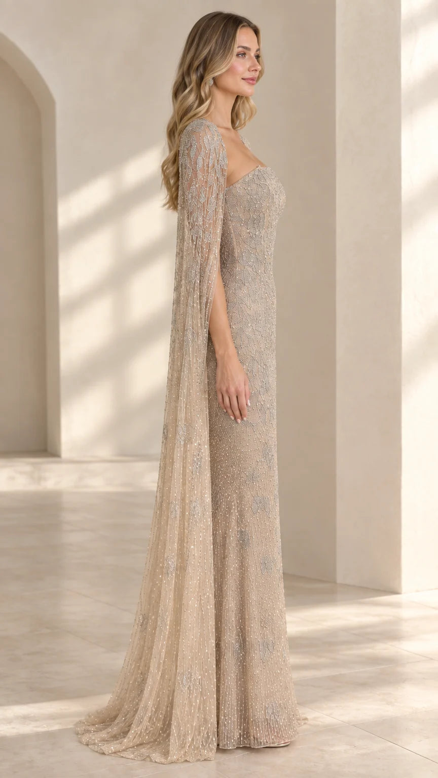 Side angle of model in champagne sequined formal gown showcasing cape drape