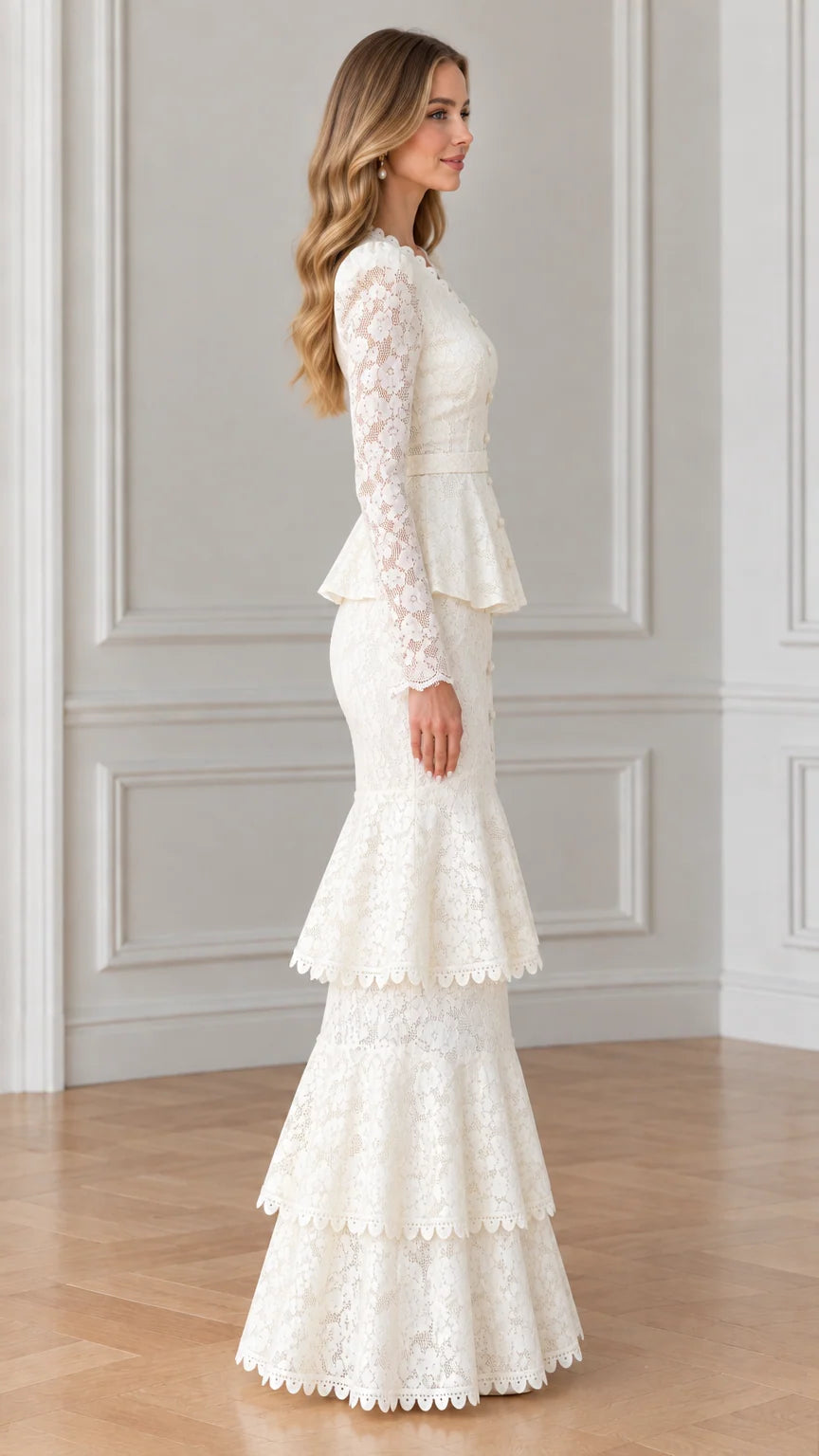Side profile of woman in white belted lace maxi dress with tiered flared skirt