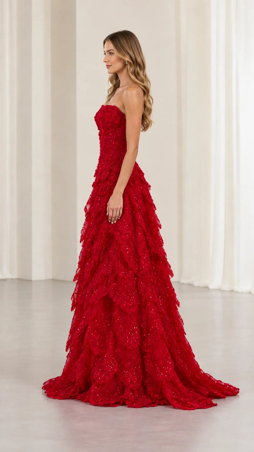 Side profile of red strapless sequin embroidered formal gown