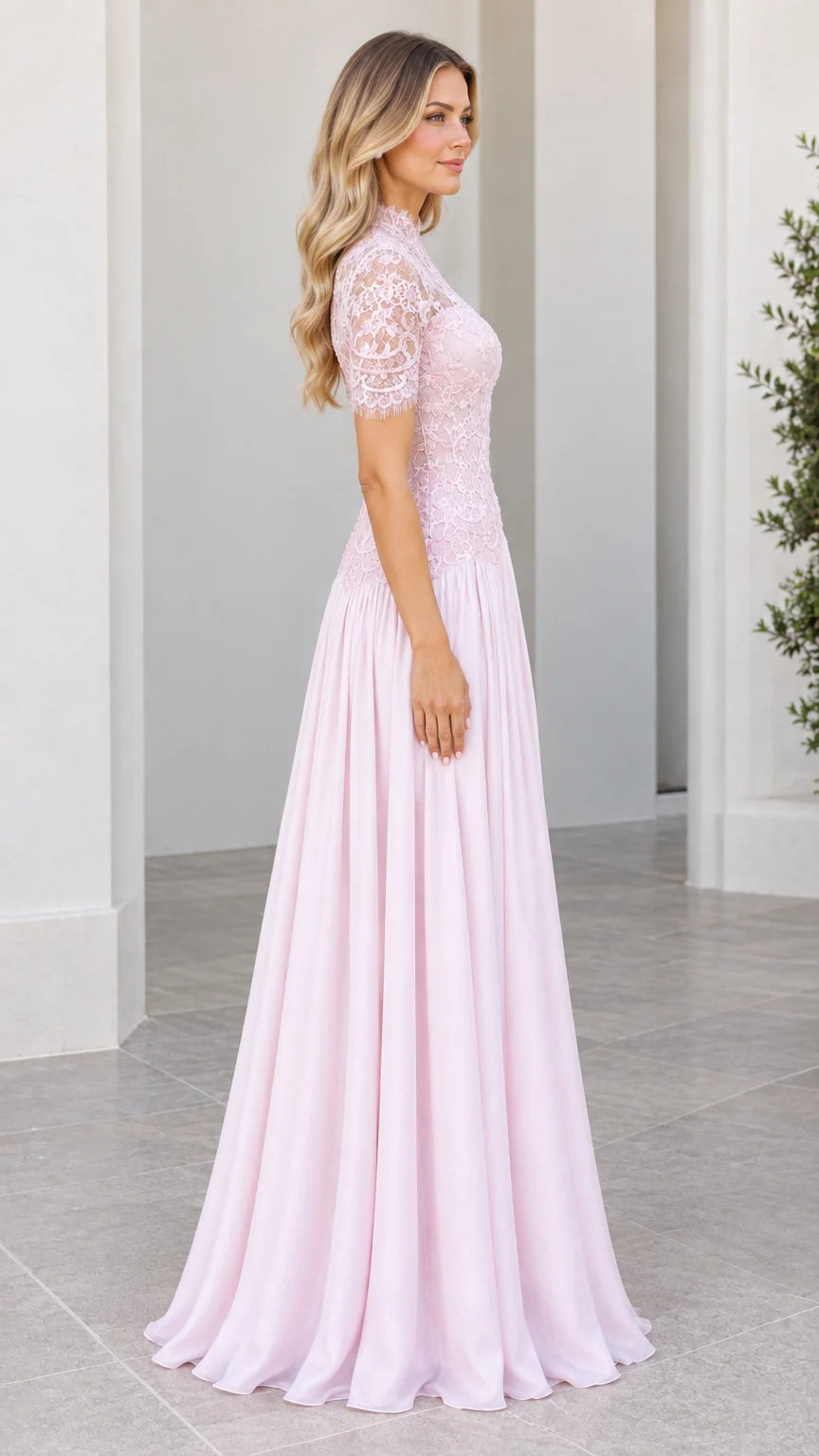 Side profile view of model in Blush Pink short sleeve lace and chiffon formal dress