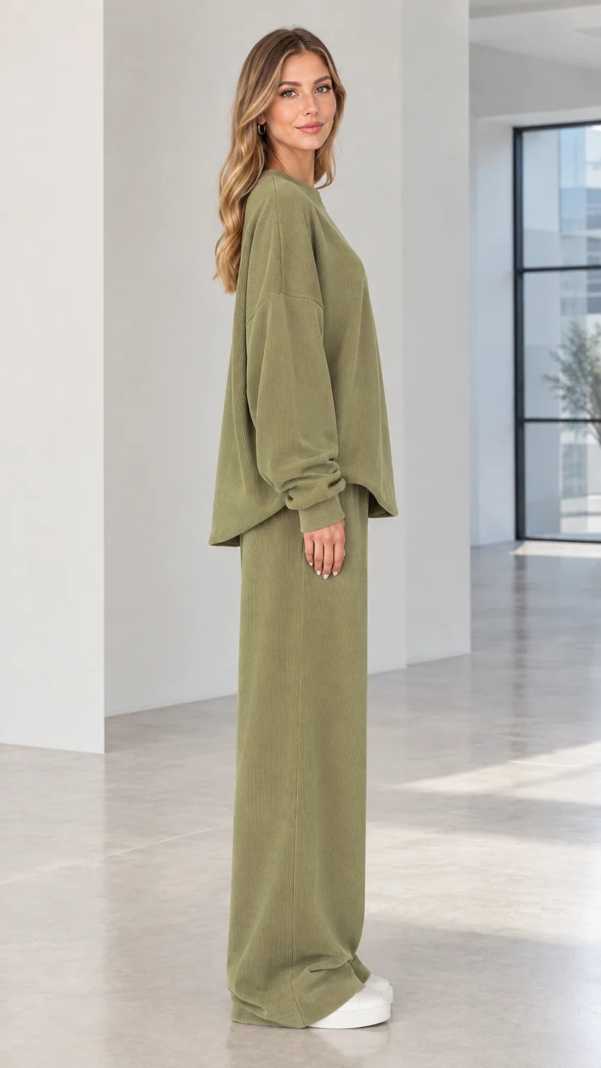 Side angle of woman wearing olive green two-piece ribbed matching lounge set