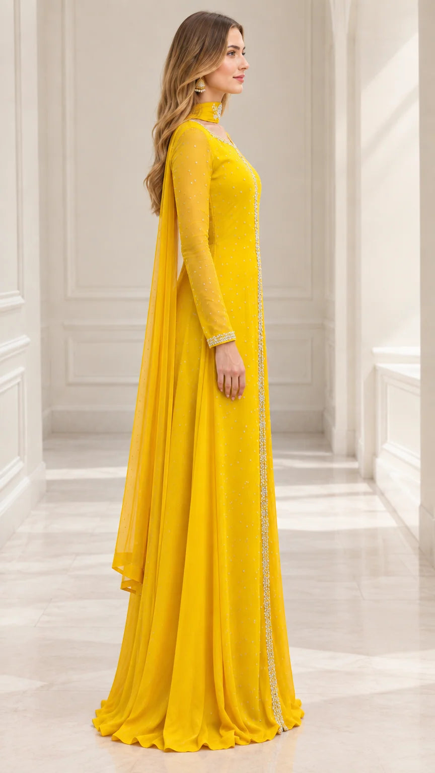 Side profile of yellow long sleeve formal gown showing flowing cape silhouette