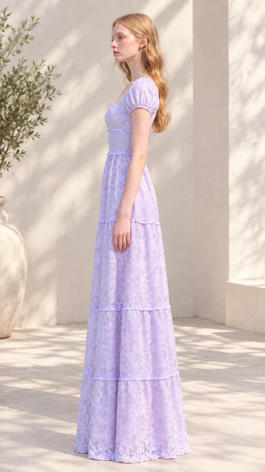 Side profile view of lavender tiered lace maxi gown