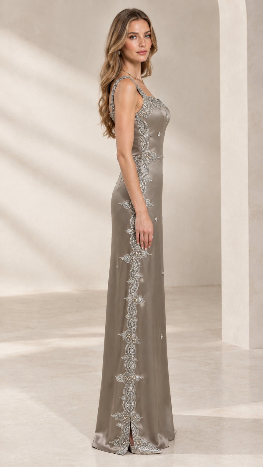 Side profile of taupe satin evening gown showing intricate beading and side slit