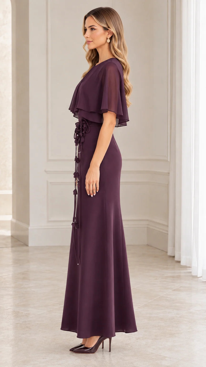 Side profile view of woman modeling the plum capelet evening gown