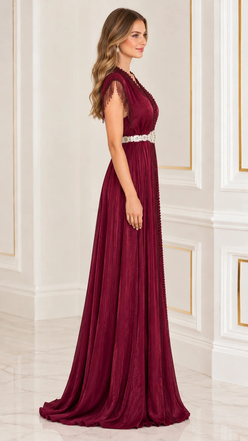 Side profile of burgundy pleated kaftan floor length evening gown