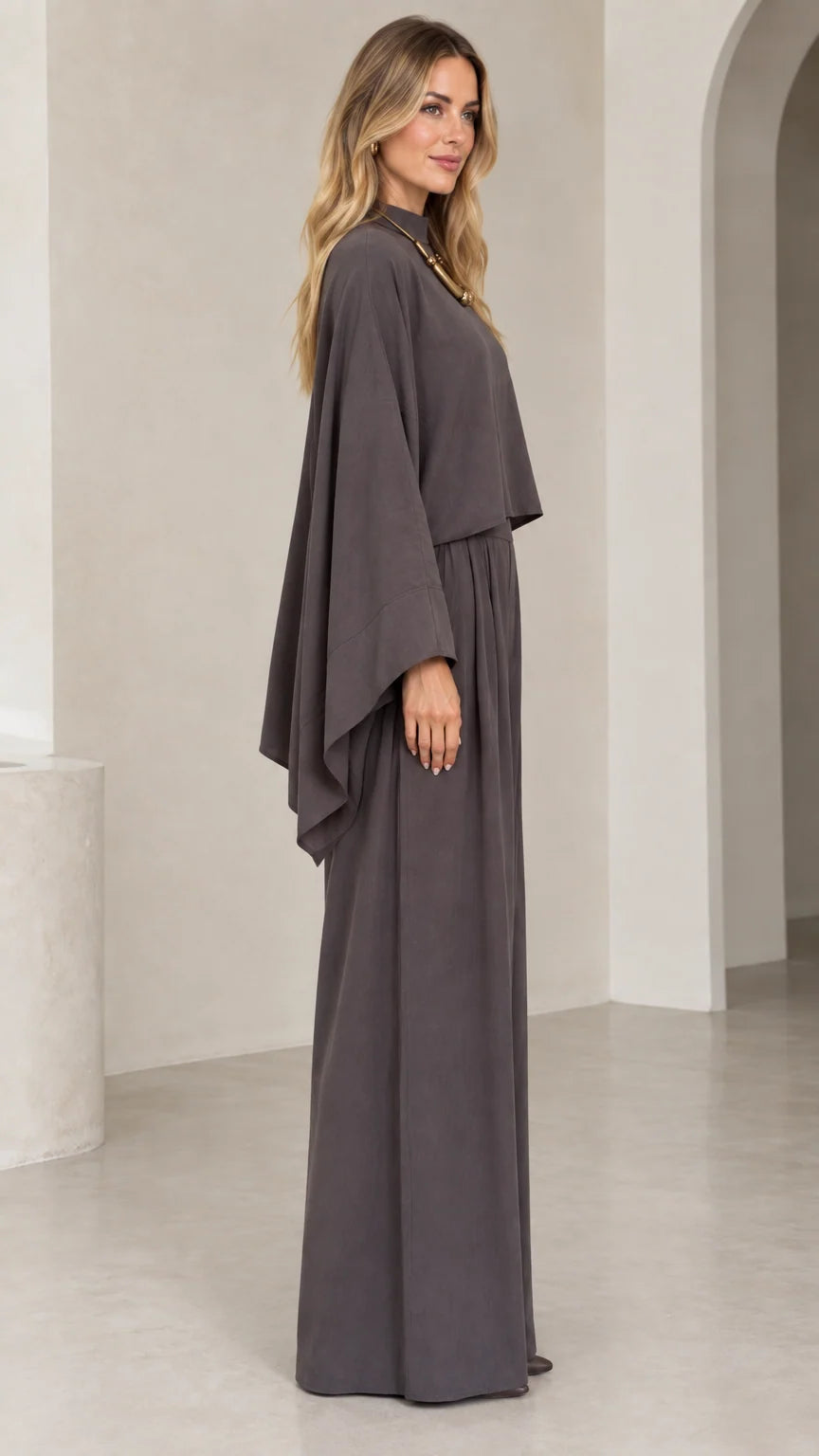 Side profile view of woman wearing charcoal grey flowing wide leg two-piece set