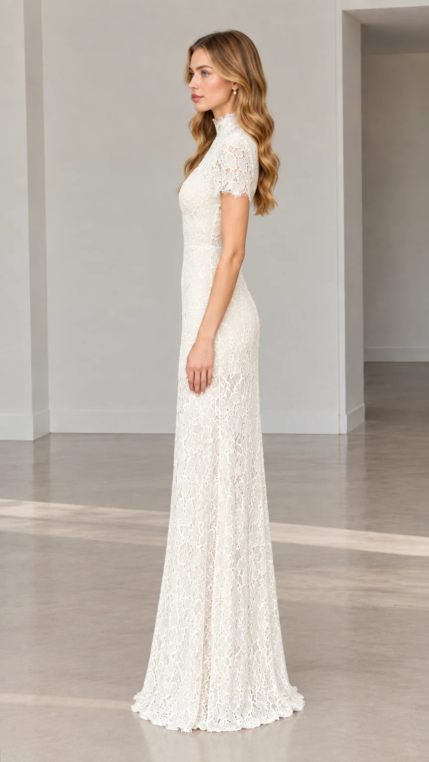 Side full-length view of model wearing ivory high-neck floral lace gown