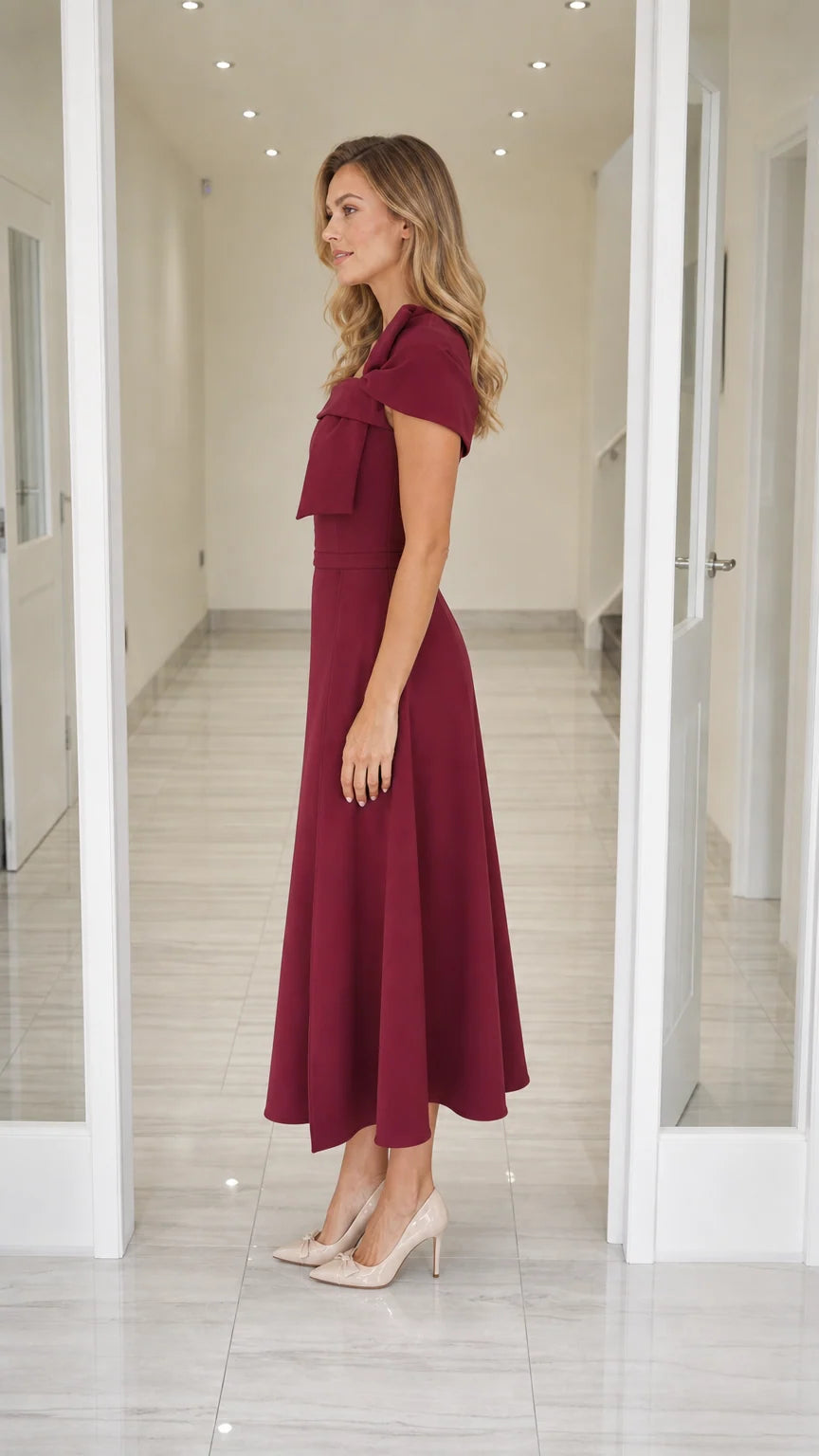 Side profile view of burgundy midi dress