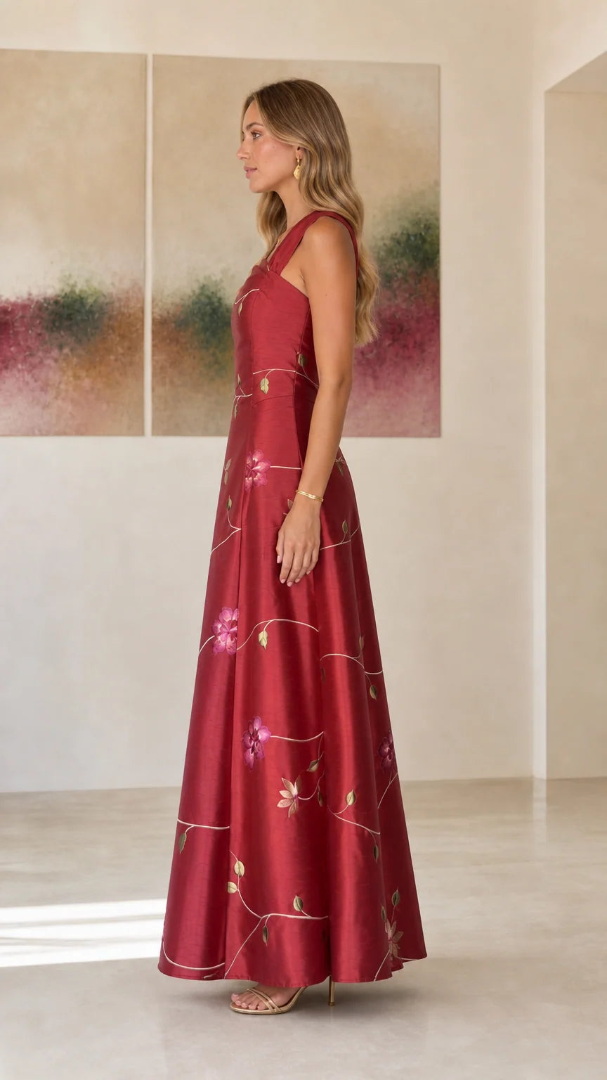 Side profile view of burgundy evening dress