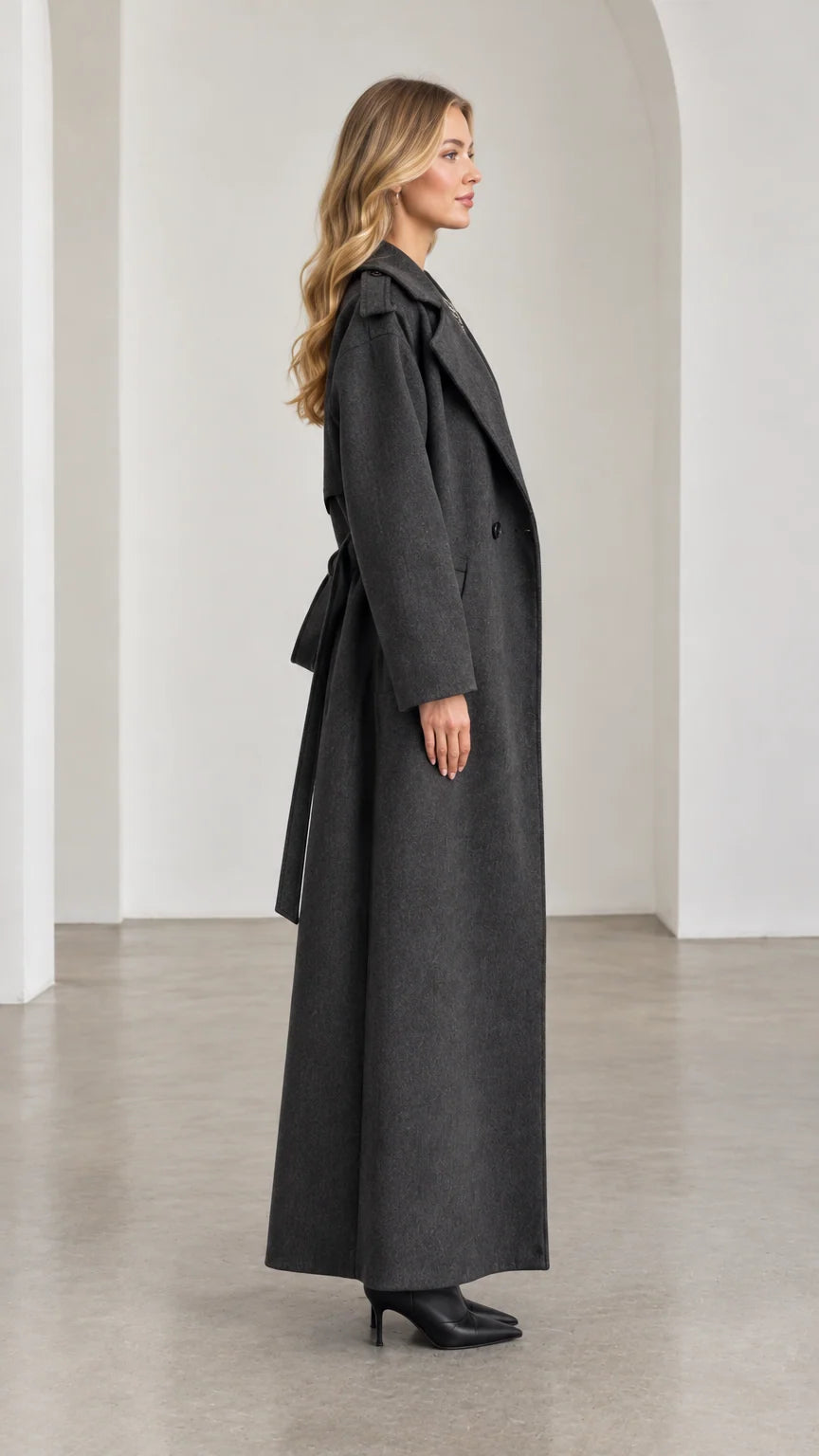 Side profile of model in full-length Charcoal Grey wool-look overcoat