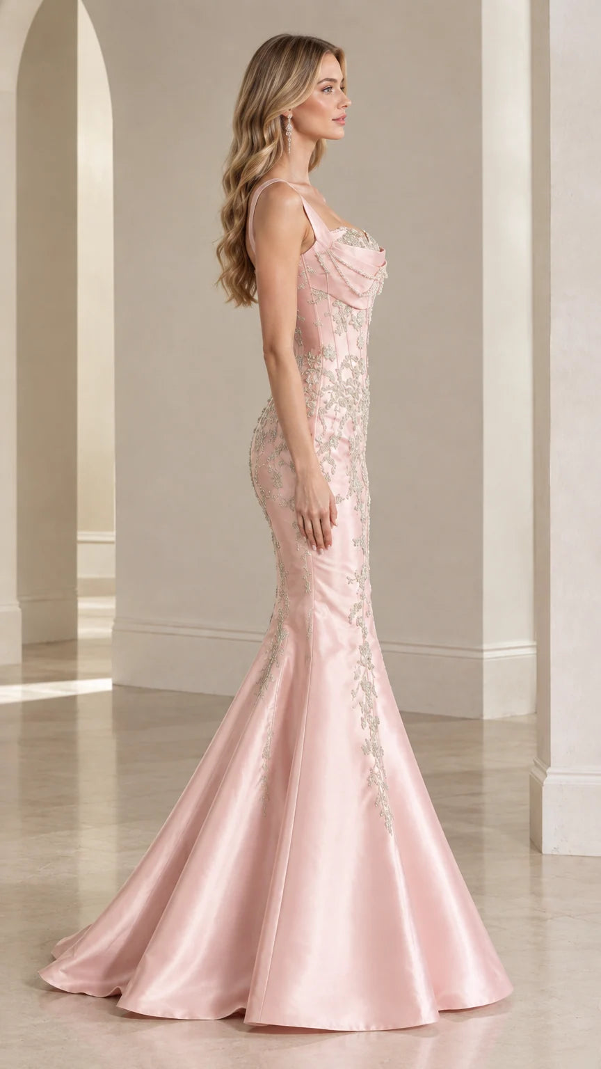 Side profile view of blush pink satin mermaid evening dress with train