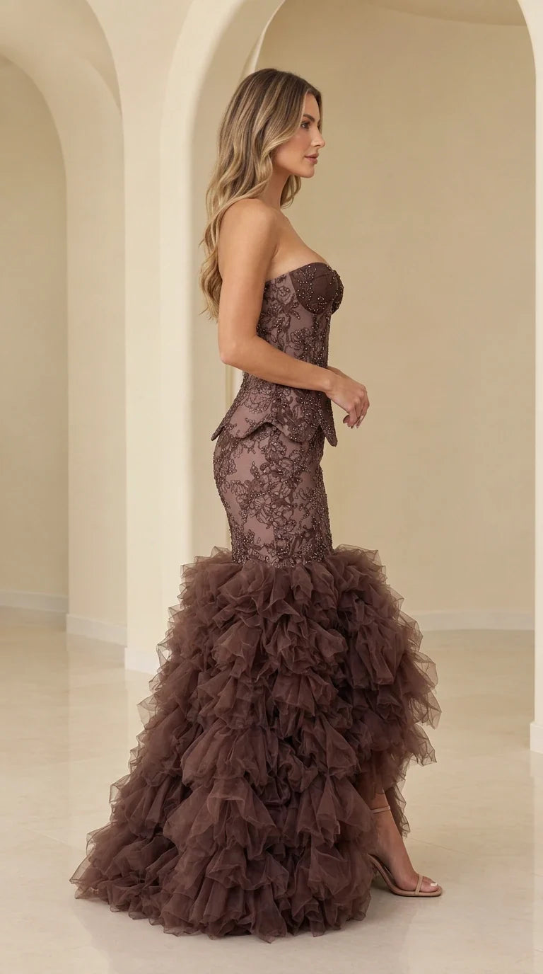 Side profile view of chocolate brown strapless beaded lace evening gown