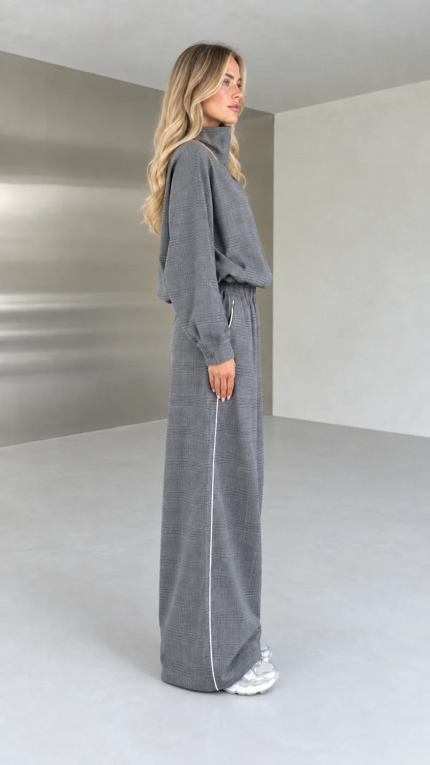 Side profile view of grey plaid two-piece matching set