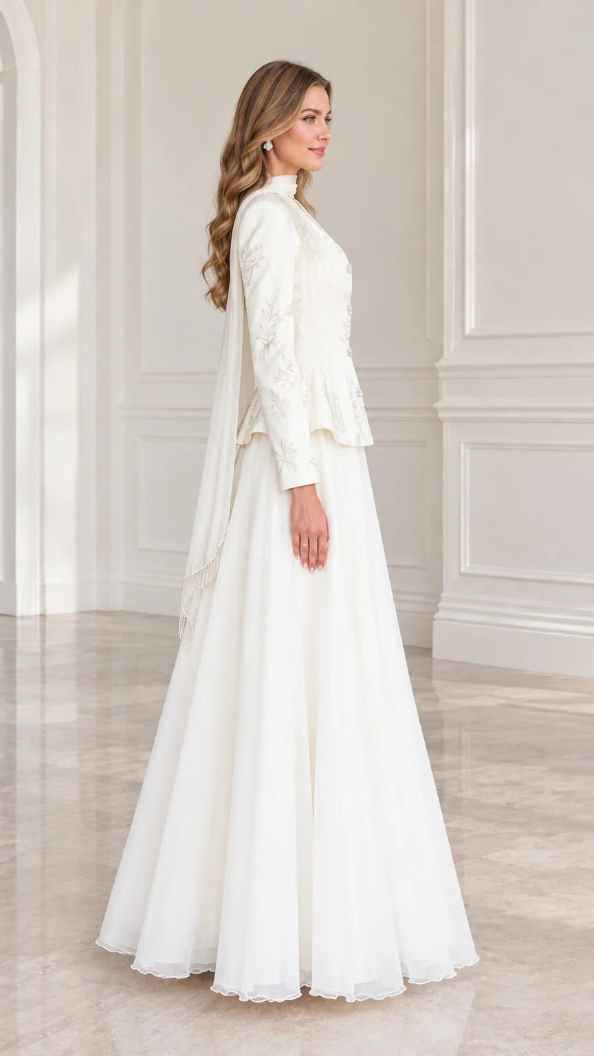 Side profile view of woman wearing Ivory two-piece peplum maxi dress set