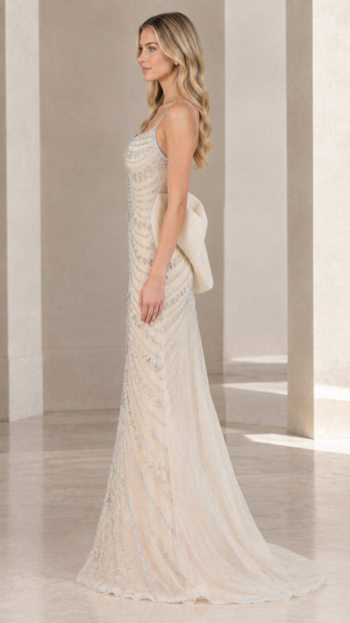 Side profile of champagne beaded formal gown showing slim silhouette