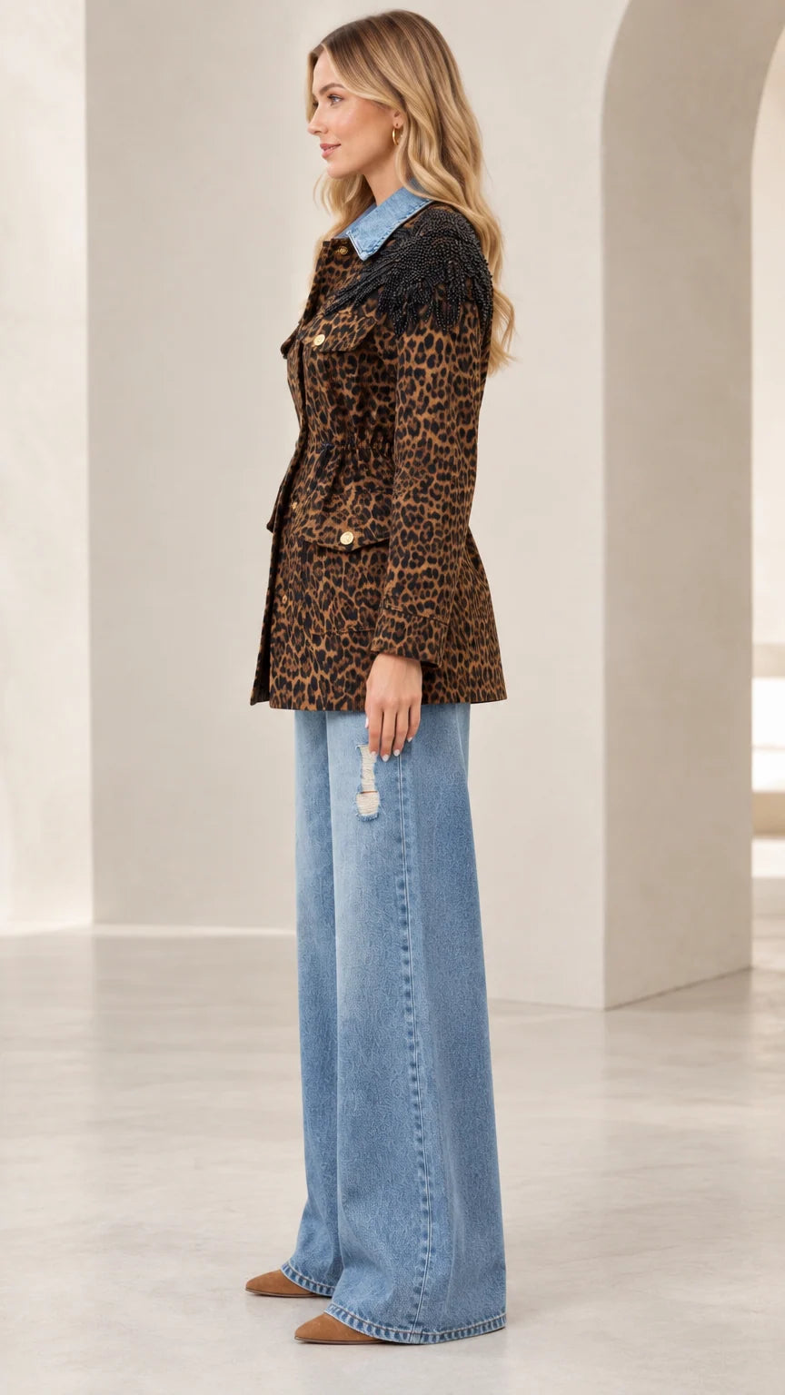 Side profile view of women's leopard print belted utility jacket