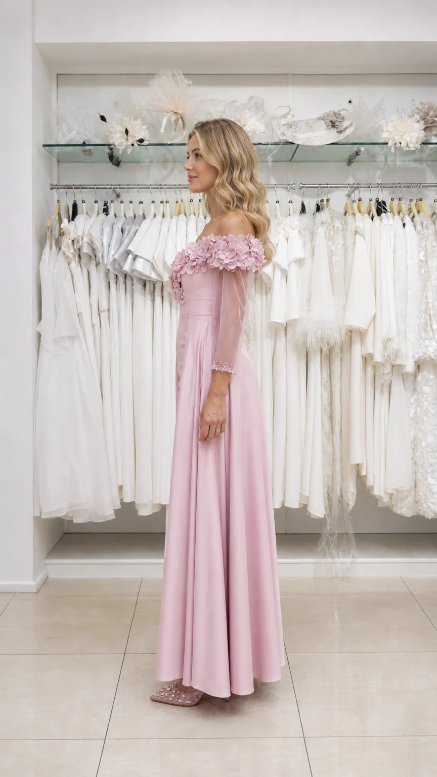 Model wearing pink evening gown, side view