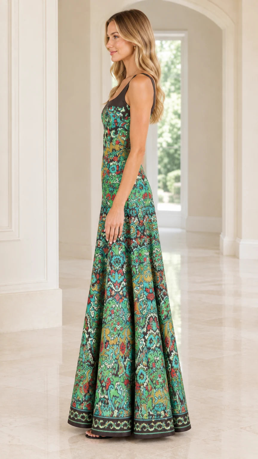 Side profile view of woman wearing teal green vintage print A-line floor length gown